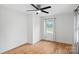 Bright bedroom with hardwood floors and a ceiling fan at 6301 Vernedale Rd, Charlotte, NC 28212