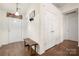 Welcoming foyer with hardwood floors and ample closet space at 6708 Burning Oak Ln, Charlotte, NC 28216