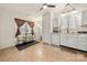 Eat-in kitchen features white cabinetry and a window overlooking the backyard at 6708 Burning Oak Ln, Charlotte, NC 28216