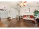 Inviting living room features hardwood floors, a ceiling fan, and neutral decor at 6708 Burning Oak Ln, Charlotte, NC 28216