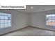 Bright bedroom featuring neutral carpet, natural light from windows, and light walls at 8018 Kennesaw Dr, Gastonia, NC 28056