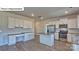 Modern kitchen with stainless steel appliances, granite countertops, and an island at 8018 Kennesaw Dr, Gastonia, NC 28056