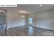 Bright living room featuring hardwood floors and a chandelier at 8018 Kennesaw Dr, Gastonia, NC 28056