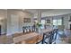 Inviting dining room with an elongated table, modern decor, and open layout at 8073 Kennesaw Dr, Gastonia, NC 28056