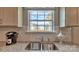 Close up of granite countertops and kitchen sink area with modern faucet and a view of the backyard at 8073 Kennesaw Dr, Gastonia, NC 28056