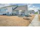 View of the backyard with patio, outdoor furniture, and well-maintained lawn space at 8573 River Ridge Dr, Charlotte, NC 28213