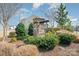 Community entrance with a decorative stone sign and manicured landscaping at 8573 River Ridge Dr, Charlotte, NC 28213