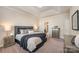 Main bedroom boasts tray ceiling, plush carpet, and coordinated furnishings at 8573 River Ridge Dr, Charlotte, NC 28213