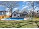 Home exterior with gunite pool, screened-in porch, and well-maintained lawn at 9200 Four Acre Ct, Charlotte, NC 28210