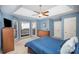 Bedroom showcasing a window seat, TV, closet, and blue walls provides a functional and relaxing area at 9200 Four Acre Ct, Charlotte, NC 28210