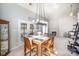 Elegant dining area with a fireplace, plenty of natural light, and an inviting atmosphere for gatherings at 9200 Four Acre Ct, Charlotte, NC 28210