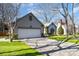 View of a house with two car garage and lush green lawn on a beautiful day at 9200 Four Acre Ct, Charlotte, NC 28210