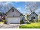 Charming home with a well-manicured lawn, two car garage, and a blue front door at 9200 Four Acre Ct, Charlotte, NC 28210