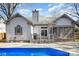 Exterior of house featuring a screened in porch, deck with railings, and a clean backyard at 9200 Four Acre Ct, Charlotte, NC 28210