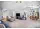 Large living room with comfortable furniture, tall ceilings, and natural light from large windows at 9200 Four Acre Ct, Charlotte, NC 28210