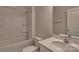 Bathroom featuring white tile walls and shower-tub combo at 9534 Maltese Dr, Gastonia, NC 28056