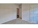 Bedroom with neutral carpet and doorway leading to closet at 9534 Maltese Dr, Gastonia, NC 28056