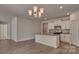 Bright kitchen features an island, white cabinets, and stainless steel appliances at 9534 Maltese Dr, Gastonia, NC 28056