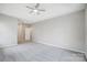 A bedroom featuring carpet, neutral colored walls, and a ceiling fan at 10011 Forest View Ln, Charlotte, NC 28213