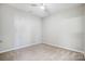 A bedroom featuring carpet, neutral colored walls, and a ceiling fan at 10011 Forest View Ln, Charlotte, NC 28213