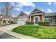 Well-maintained home with a manicured lawn, brick detail, and an attached two-car garage at 10011 Forest View Ln, Charlotte, NC 28213