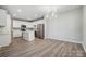 Modern kitchen featuring white cabinets, stainless steel appliances, and a center island at 10011 Forest View Ln, Charlotte, NC 28213