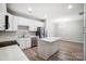 Bright kitchen features white cabinetry, stainless steel appliances, and a center island at 10011 Forest View Ln, Charlotte, NC 28213