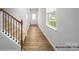 Welcoming entryway featuring a staircase, wood-look floors, and a view of the front door at 1026 Hostler Ln, York, SC 29745