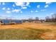 Expansive backyard view showing the rear exterior and surrounding landscape at 114 Hallmark Estates Dr, Statesville, NC 28625