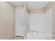 Bathroom featuring a shower-tub combo with paneled walls at 114 Hallmark Estates Dr, Statesville, NC 28625