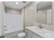 Well-lit bathroom featuring a bathtub with shower and marble-style vanity at 114 Hallmark Estates Dr, Statesville, NC 28625