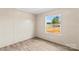 Bright bedroom featuring wood-look flooring and a large window with backyard view at 114 Hallmark Estates Dr, Statesville, NC 28625