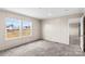 Carpeted bedroom with natural light from large windows and paneled walls at 114 Hallmark Estates Dr, Statesville, NC 28625