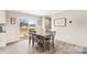 Bright dining room with wood-look flooring and sliding glass door leading to outdoor space at 114 Hallmark Estates Dr, Statesville, NC 28625