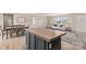 Kitchen with island connects to dining and living room, creating an open feel at 114 Hallmark Estates Dr, Statesville, NC 28625