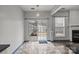 Dining area with a view of the backyard, featuring a sliding glass door and natural light at 11712 Huxley Rd, Charlotte, NC 28277