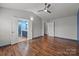 Spacious main bedroom featuring ensuite bathroom and wood-look flooring at 11712 Huxley Rd, Charlotte, NC 28277