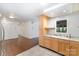 Well-lit kitchen features stainless steel appliances and light wood cabinets at 1323 Queens Rd # 202, Charlotte, NC 28207