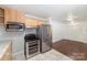 Kitchen featuring stainless steel appliances, tile flooring, and light wood cabinets at 1323 Queens Rd # 202, Charlotte, NC 28207