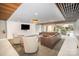 Modern lobby features a leather sectional and large windows overlooking greenery at 1323 Queens Rd # 202, Charlotte, NC 28207