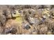 Aerial view of a residential neighborhood with a well-maintained yard and mature trees at 1707 W 4Th Ave, Gastonia, NC 28052