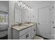 Well-lit bathroom with double sinks, granite countertops, and modern fixtures at 1707 W 4Th Ave, Gastonia, NC 28052