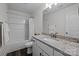 Bright bathroom with a combination shower and tub and granite countertops at 1707 W 4Th Ave, Gastonia, NC 28052