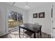 Bright dining area with sliding door access to outdoor deck at 1707 W 4Th Ave, Gastonia, NC 28052