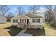 Charming single-story home with welcoming porch, well-manicured lawn, and tasteful landscaping at 1707 W 4Th Ave, Gastonia, NC 28052