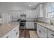 Well-equipped kitchen featuring modern appliances, granite countertops and ample natural light at 1707 W 4Th Ave, Gastonia, NC 28052