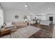 Bright and airy living room featuring modern decor and an open layout into the kitchen at 1707 W 4Th Ave, Gastonia, NC 28052