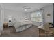 Serene main bedroom with natural light, neutral décor, and a ceiling fan at 1707 W 4Th Ave, Gastonia, NC 28052