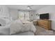 Comfortable main bedroom features a ceiling fan, soft natural light, and a relaxed seating area at 1707 W 4Th Ave, Gastonia, NC 28052