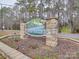 Community entrance sign with stone columns and landscaping at 171 Holly Harbor Trl # B62, Mount Gilead, NC 27306